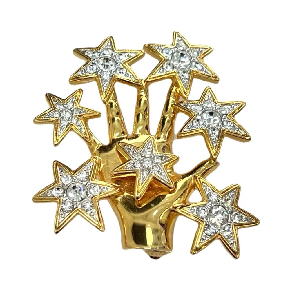 NOLAN MILLER SHINY GOLDEN HAND WITH CRYSTAL STARS BROOCH